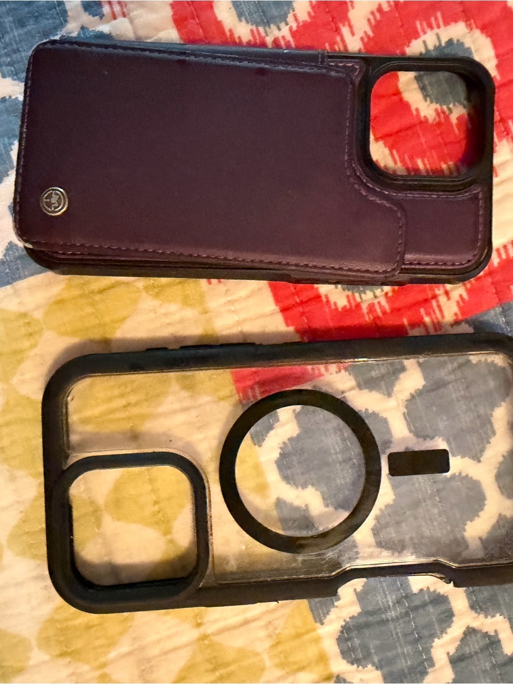 Set of 2 iPhone 16 Pro Max phone cases: one purple Wallet, one black and clear
